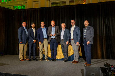 From left to right: Mike Richardson (Director, GFD Merchandising, SpartanNash), Arpen Shah (VP, Merchandising Strategy and Analytics, SpartanNash), Joey Matos (Senior Director of Sales, Danone S.A.), Dave Koncki (Key Account Manager, Danone S.A.), Tony Sarsam (CEO, SpartanNash), Bennett Morgan (SVP and Chief Merchandising Officer, SpartanNash), Brandon Pasch (VP, Center Store Merchandising, SpartanNash)